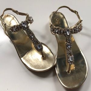 Studded woman’s gold sandals slight platform